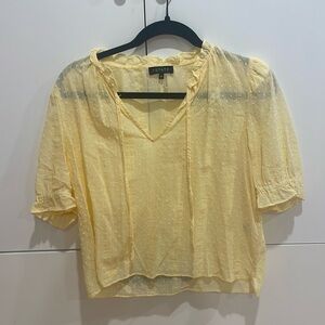 Dainty light yellow blouse.